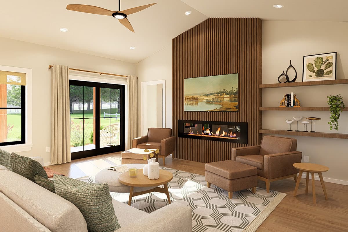 Living room with vaulted ceiling, modern linear fireplace with wood slat accent wall, and large sliding glass doors to outdoor space.