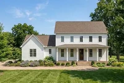 Three Bedroom Traditional Farmhouse House Plan with Inviting Front Porch