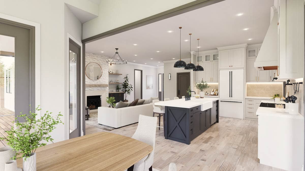 Open concept living area with kitchen island, fireplace, and dining area.