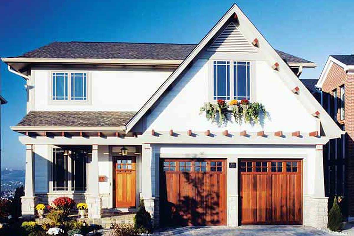 Two-story house plan exterior with a covered porch, double garage doors, and a prominent gable with a dormer window.