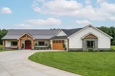 New American Ranch House Plan with 3-Car Garage and Sunroom