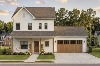 Two-Story Farmhouse House Plan with Three Bedrooms and Two-Car Garage