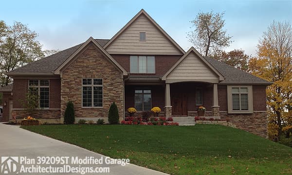 House plan exterior: Two-story home with brick and stone facade, covered porch, multiple gables, and dormer.