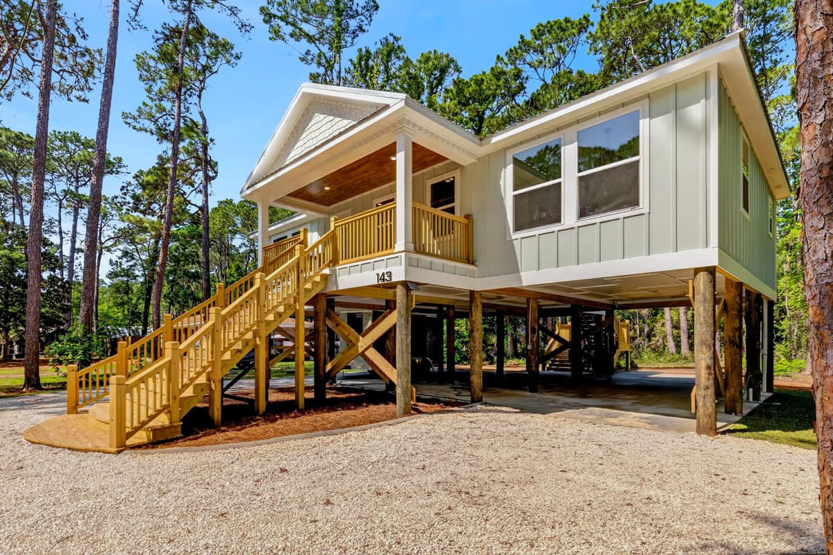 Plan 461052DNN: Coastal Beach House Plan with Three Bedrooms and Drive Under Garage - Image #2 - Beach, Coastal, Florida-Style, Low Country, Vacation