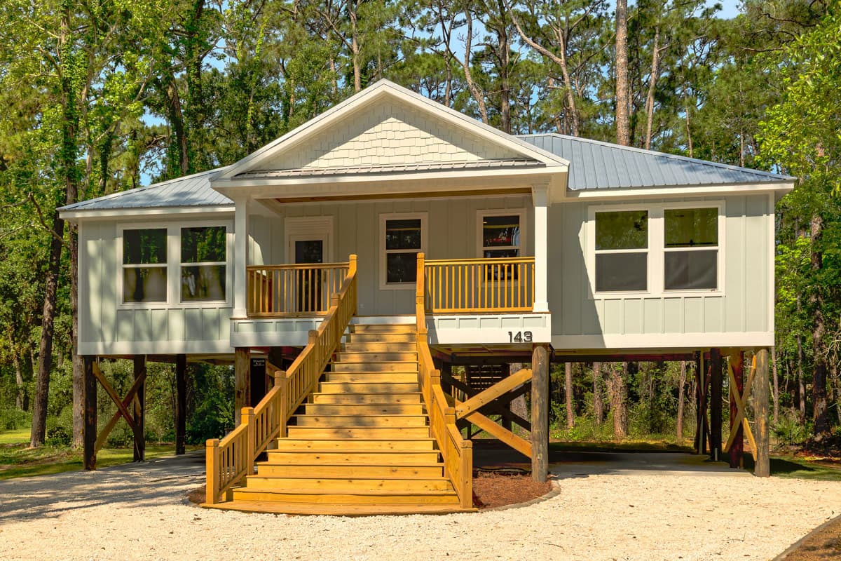 Plan image - 461052DNN:Coastal Beach House Plan with Three Bedrooms and Drive Under Garage