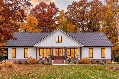 Barndominium Farmhouse House Plan Featuring Three Bedrooms and Covered Porches