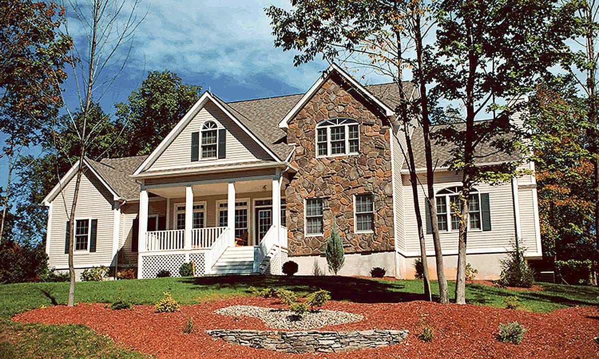 House plan exterior: Two-story home with stone facade, covered front porch with columns, multiple gables, and dormer windows.