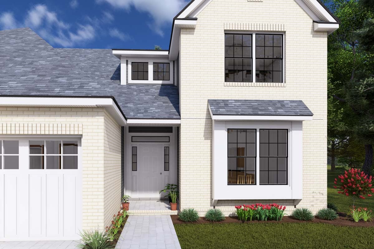 House plan exterior: Two-story modern farmhouse with brick facade, gable roof, dormers, bay window, and attached garage.
