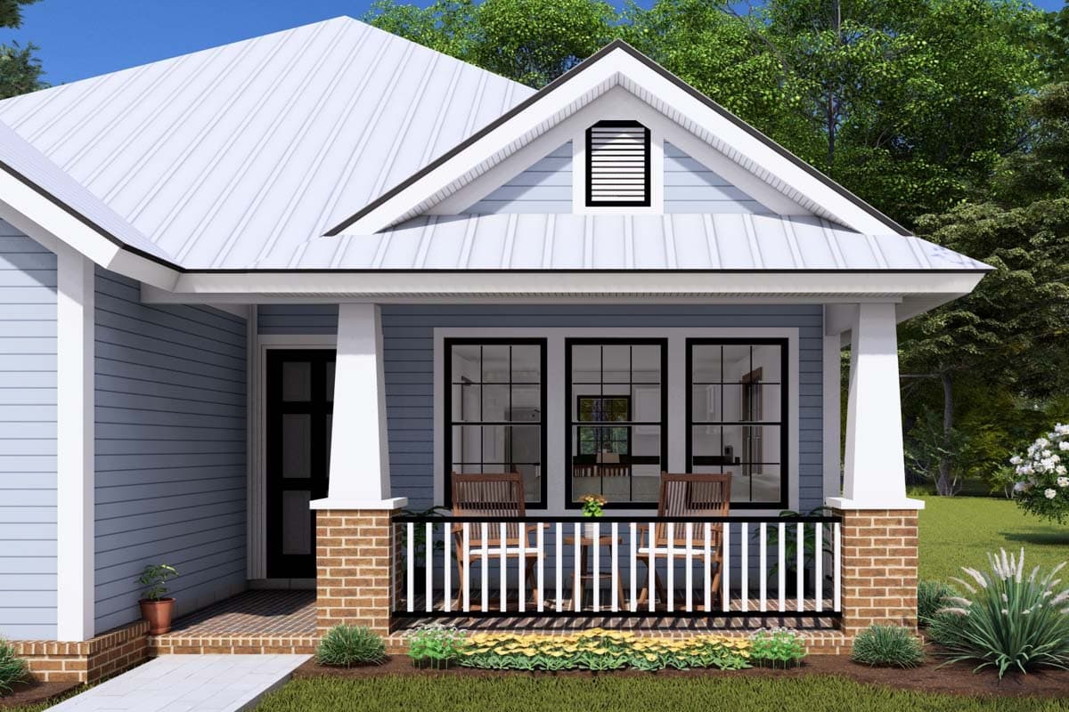 House plan exterior: Gable dormer, metal roof, and front porch with brick base and white railing.