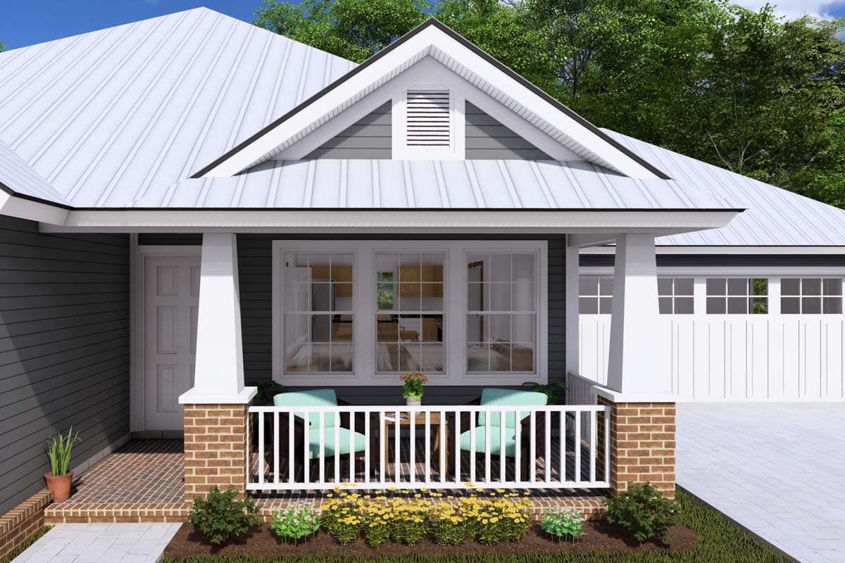 House plan exterior featuring a gabled front, metal roof, covered front porch with brick columns, and a three-car garage.