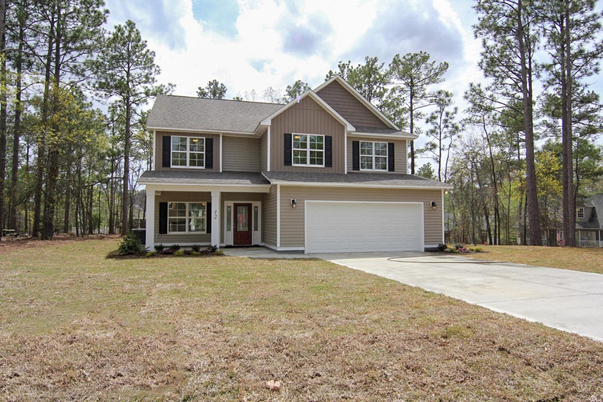 Two-story house plan exterior with a covered front porch, gable accents, and a front-facing garage.