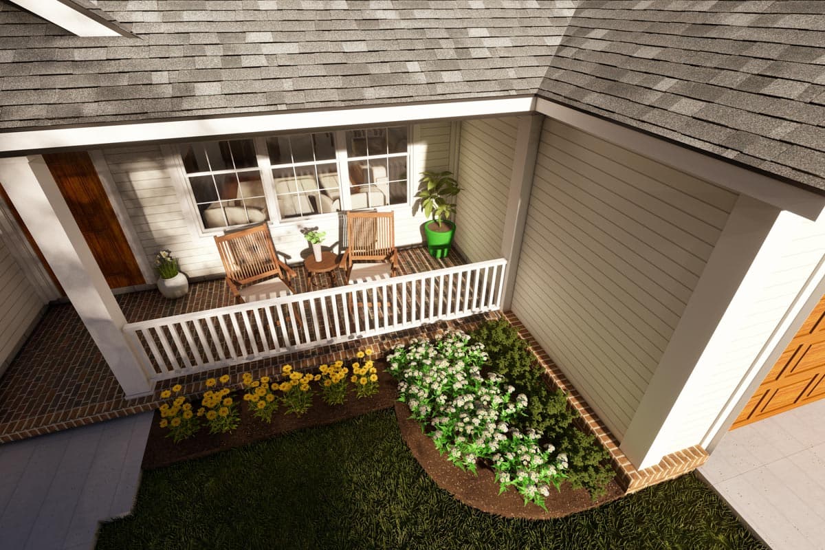 House plan exterior: Covered porch with white railing, two chairs, and a small table. Siding, brick accents, and pitched roof.