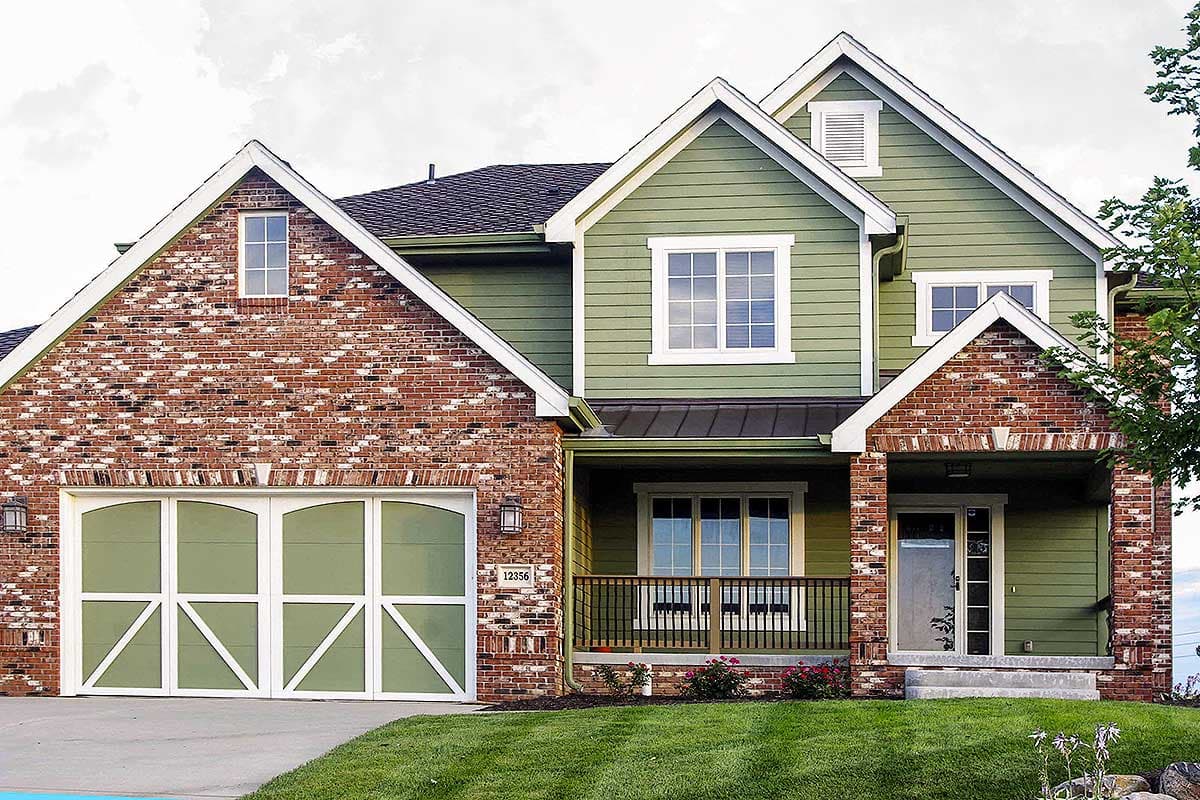 House plan exterior: Two-story home with brick and green siding, prominent gables, a covered porch, and a side-facing garage.