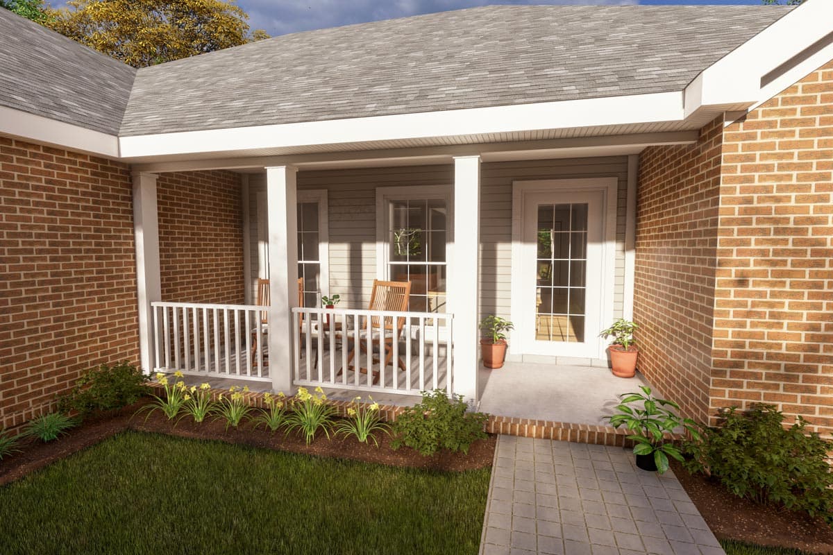 House plan exterior with brick accents, a covered porch with white railing, and multiple windows.