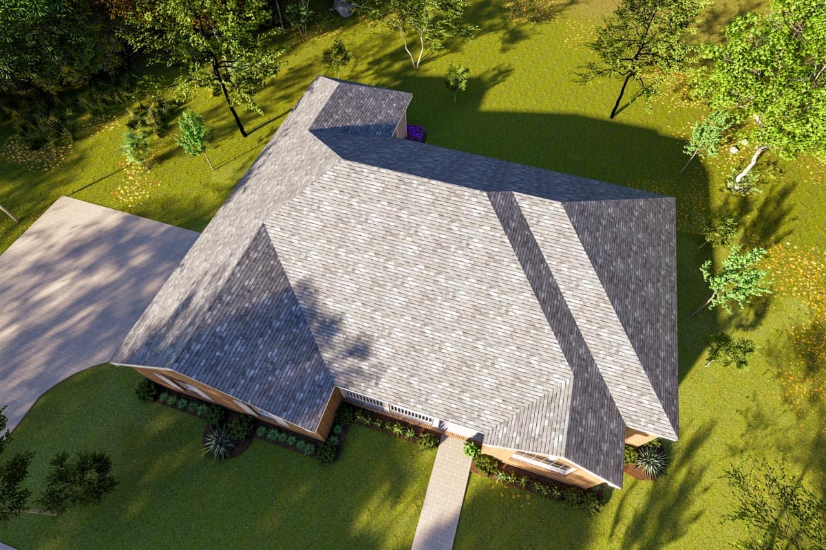 House plan exterior, aerial view of a one-story house with a complex roofline, attached garage, and gabled dormers.