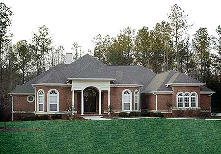 House plan exterior, one-story brick home with arched windows, columned entryway, and varied rooflines.