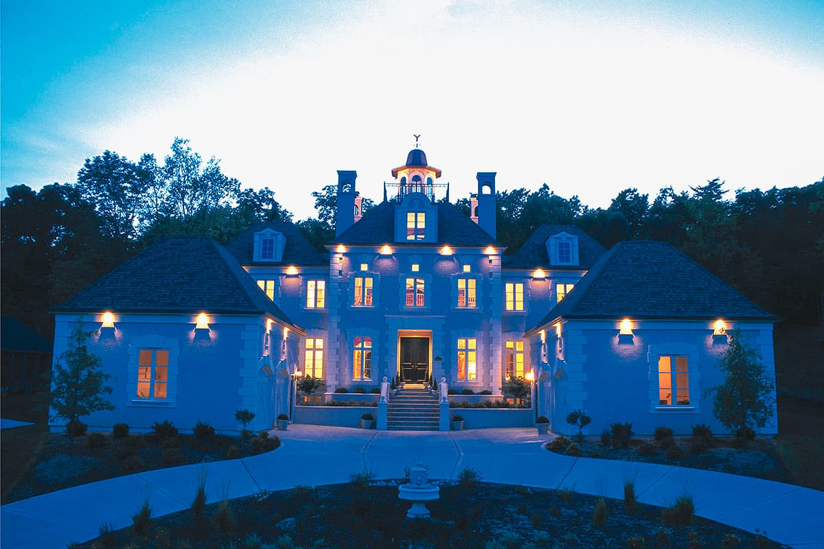 House plan exterior: Two-story French chateau style with symmetrical facade, mansard roofs, dormers, and central cupola.