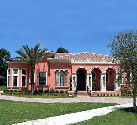 House plan exterior: Mediterranean style, one story, arched portico, tile roof, circular bay window.