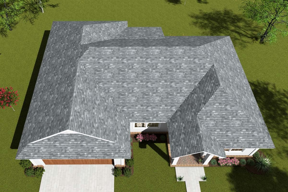 House plan exterior: One-story home with L-shaped roof, front-facing gabled dormers, covered entry, and attached two-car garage.