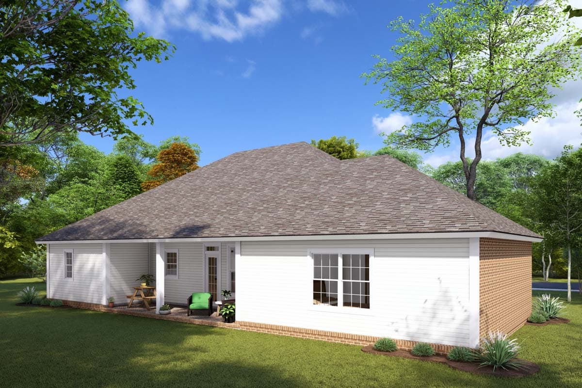 House plan exterior: One-story dwelling with white siding, brick accents, covered porch, and hip roof.