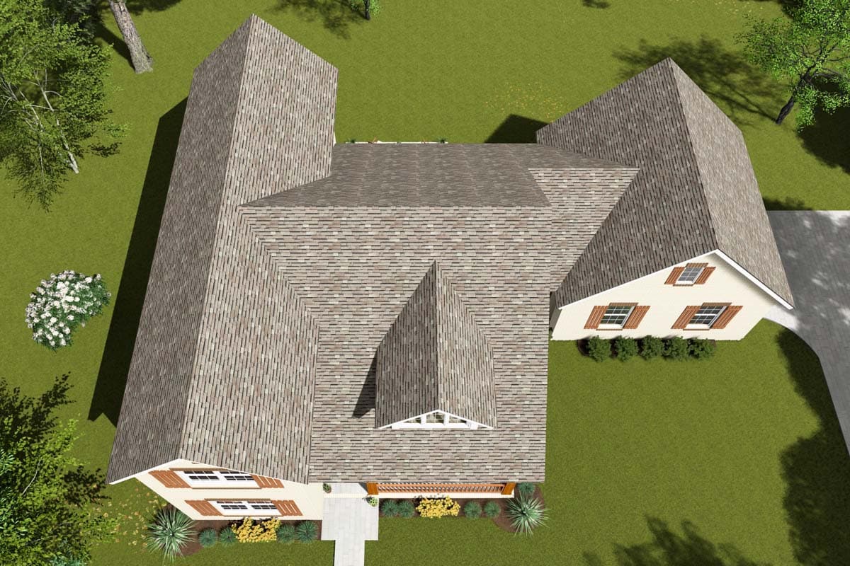 House plan exterior, overhead view, showing complex rooflines, dormer windows, and a front entrance with a covered porch.