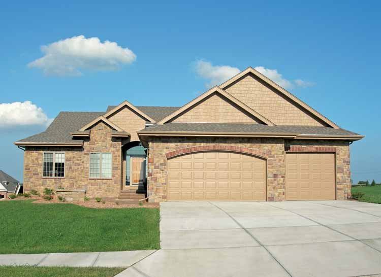 House plan exterior: Two-story home with stone facade, arched garage entry, and layered gables.