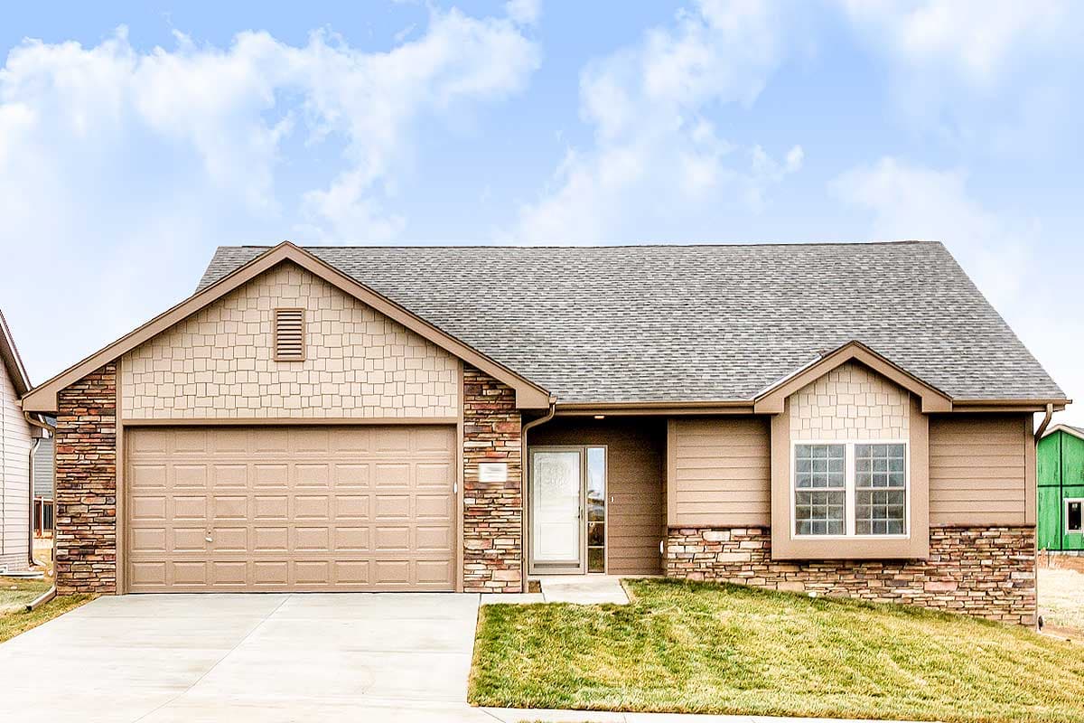 Ranch house plan exterior with attached garage, stone accents, shingle siding, and bay window.