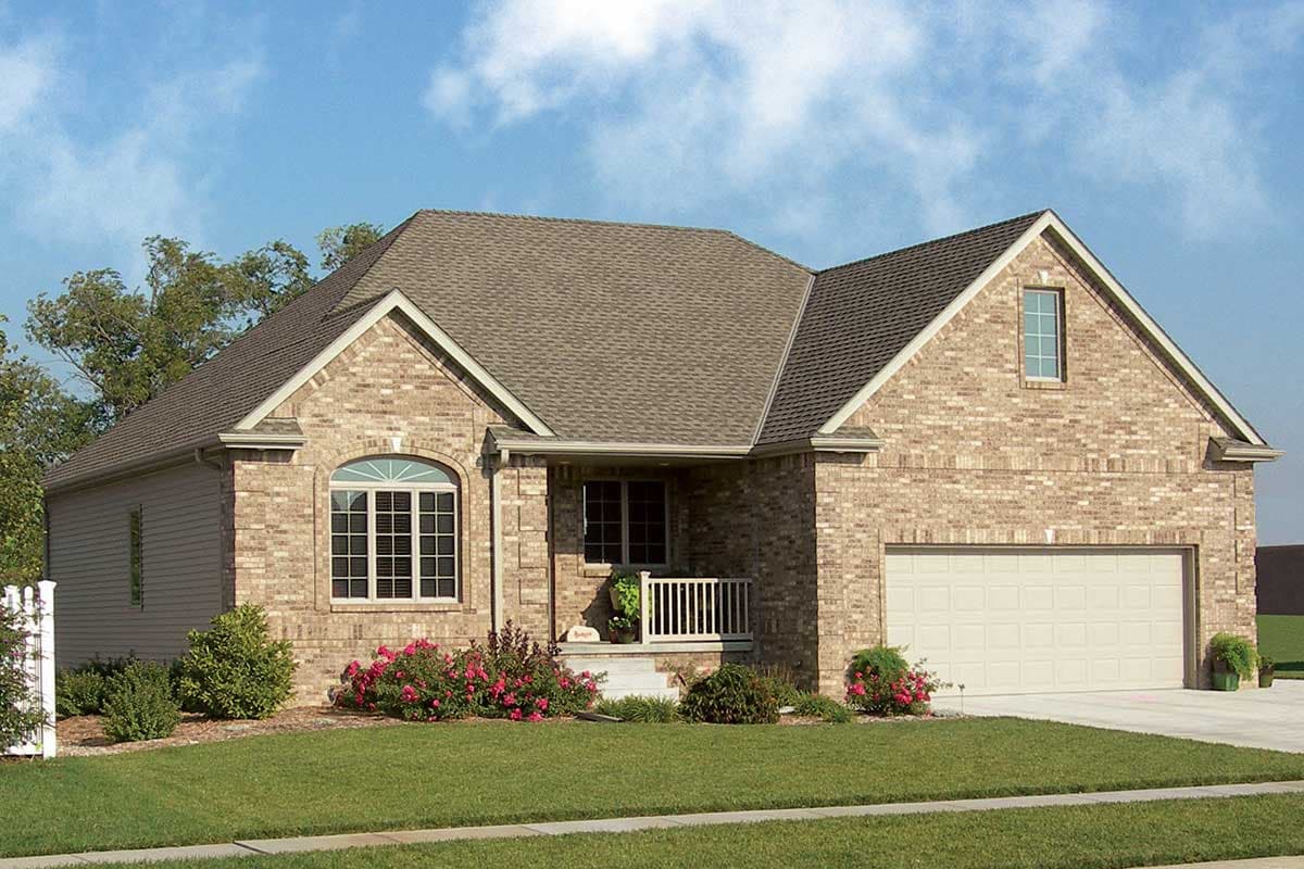 House plan exterior: Ranch style, brick and vinyl siding, covered entry porch, arched window, gable dormer, attached garage.