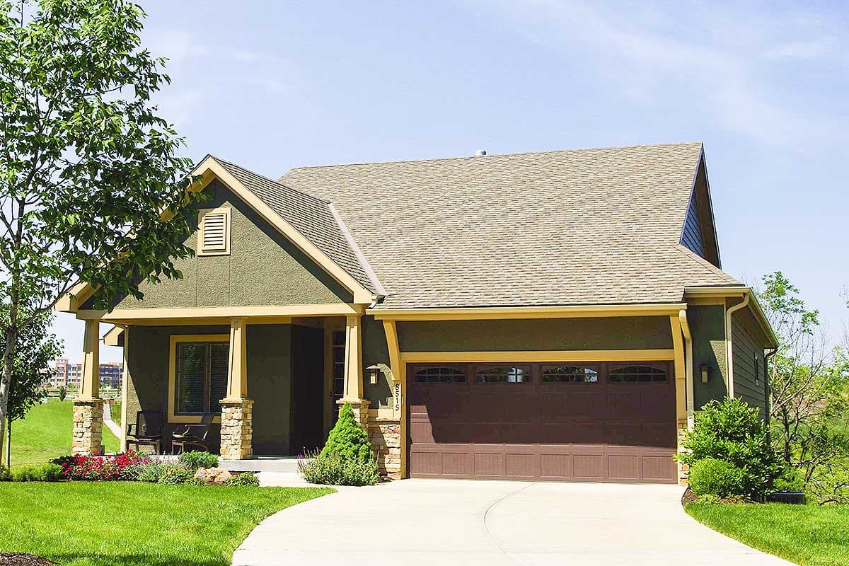 House plan exterior: Craftsman style, one story, covered front porch with stone pillars, gabled roof, and side-entry garage.