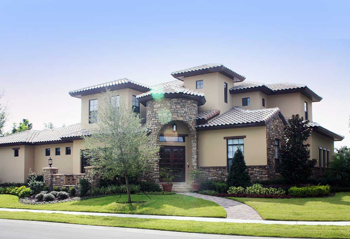 House plan exterior: Two-story Mediterranean style with arched stone entry, tile roof, stucco walls, and multiple gables.