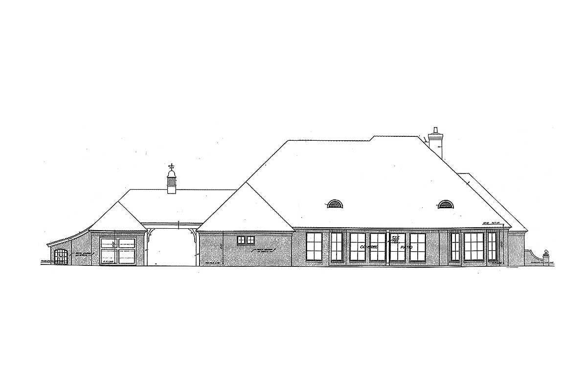 House plan side elevation showing a long, asymmetrical roofline, brick facade, arched entryway, and multiple dormers.