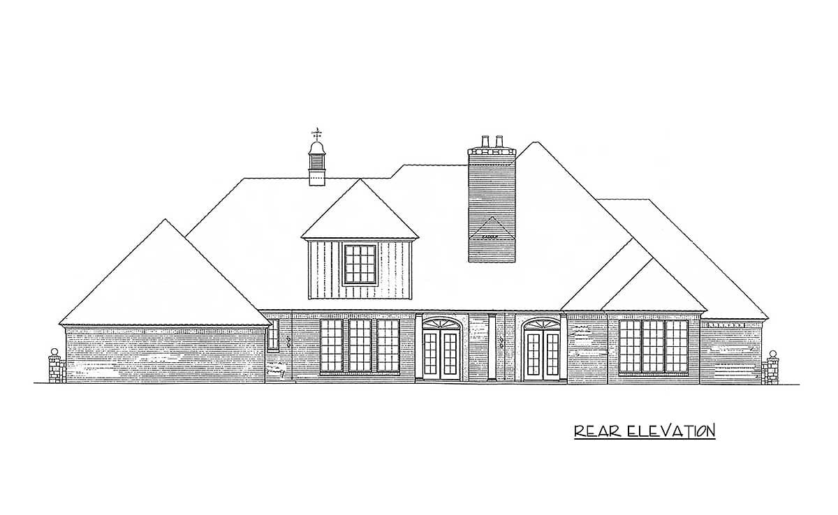 Rear elevation drawing of a house plan featuring a prominent dormer, multiple gables, a large chimney, and a double-door entry.