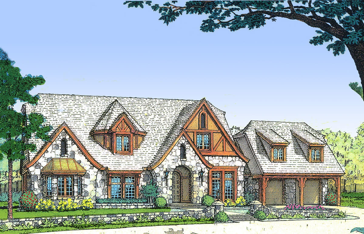 House plan exterior: stone and timber Tudor-style home with multiple gables, dormers, and a detached three-car garage.