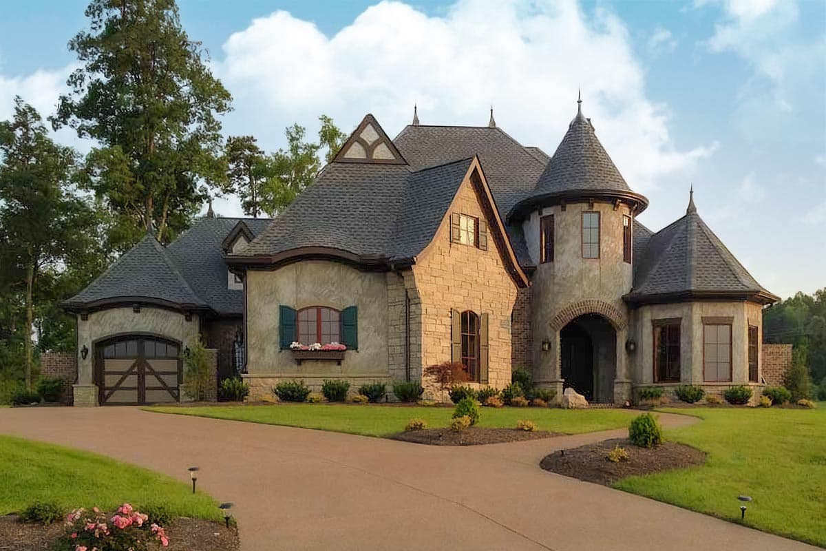 House plan exterior featuring a two-story design in a French style. Notable features include turret, gables, arched entry, and stone facade.