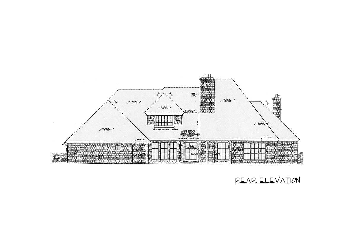 Rear elevation drawing of a house plan featuring a pitched roof, dormer, chimneys, and multiple windows.