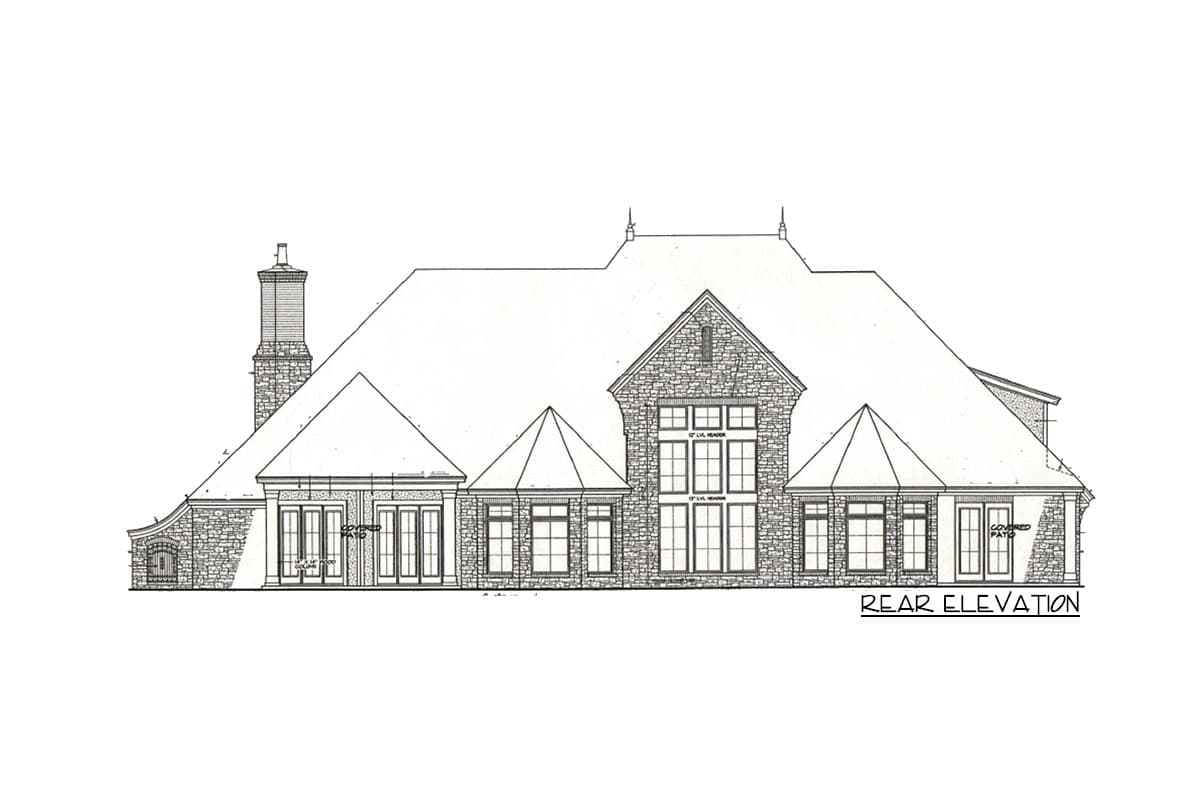 Rear elevation drawing of a stone house plan with multiple gables, large windows, chimney, and covered patio.
