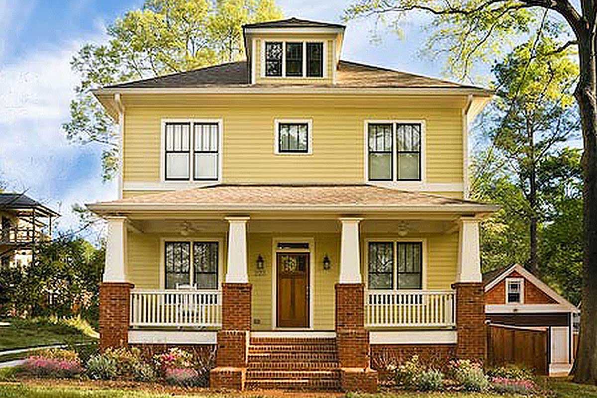 House plan exterior. Two-story house with a Craftsman style. Features include a front porch with columns, a dormer, and a hipped roof.