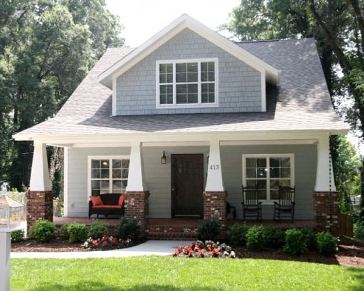 House plan exterior: Two-story Modern Farmhouse with wide front porch, brick piers, and dormer.