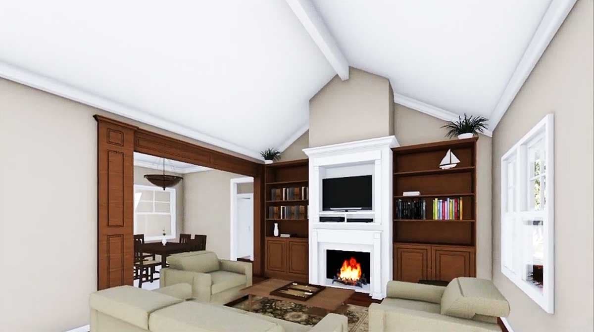 Living room with vaulted ceiling, fireplace, built-in bookshelves, and open doorway to dining area.
