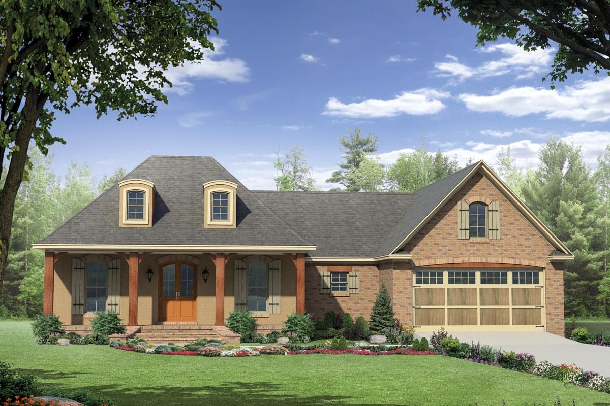 House plan exterior: Brick home with a dormered roof, arched entryway, and two-car garage.