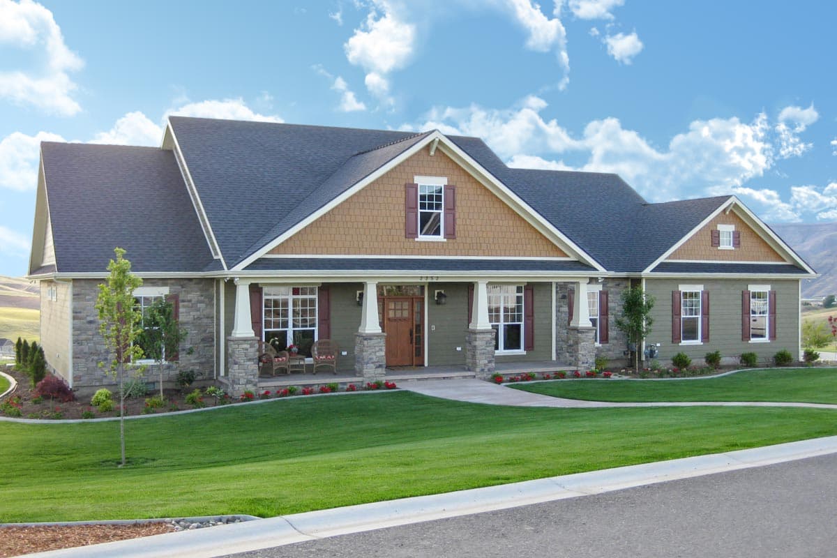 House plan exterior: Ranch style, stone facade, covered porch with columns, dormers, and gables.