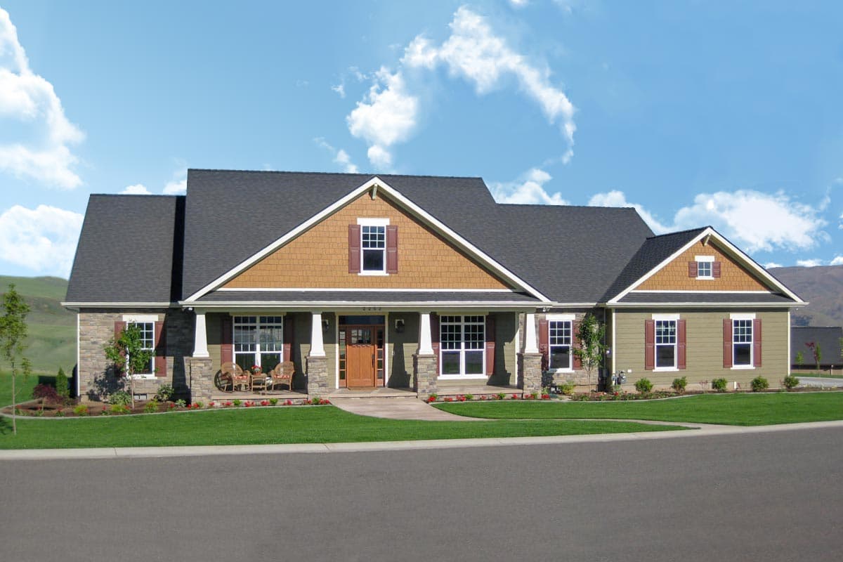 House plan exterior: One-story Modern Farmhouse with covered front porch, gabled dormers, stone accents, and cedar shingle siding.