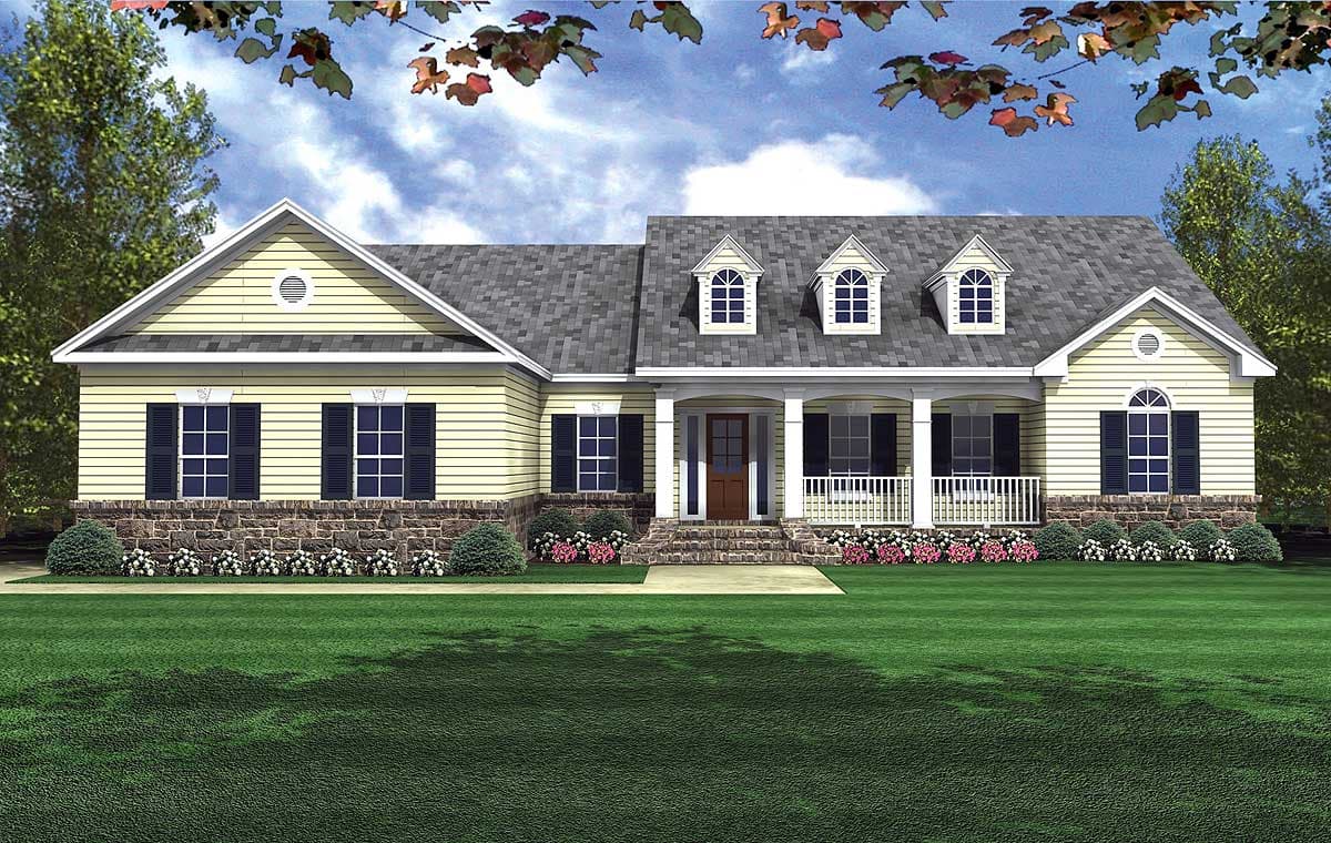 House plan exterior: single-story, yellow siding, brick foundation, prominent covered front porch with columns, and three gabled dormers.