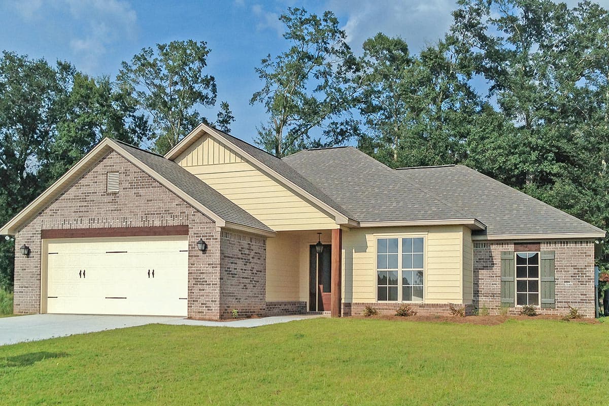 Ranch house plan exterior with brick accents, two-car garage, and covered entry porch.