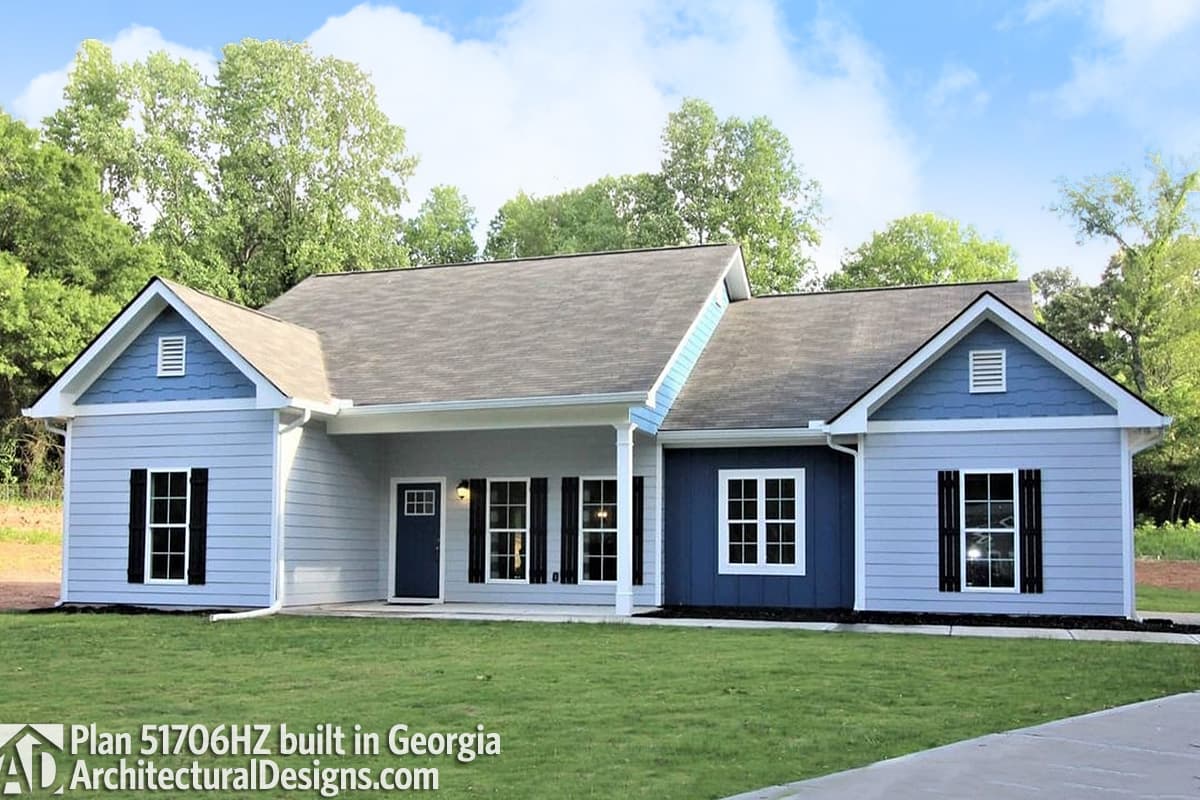 House plan exterior: One-story Modern Farmhouse with gabled roof, front porch, and siding in blue and light gray.