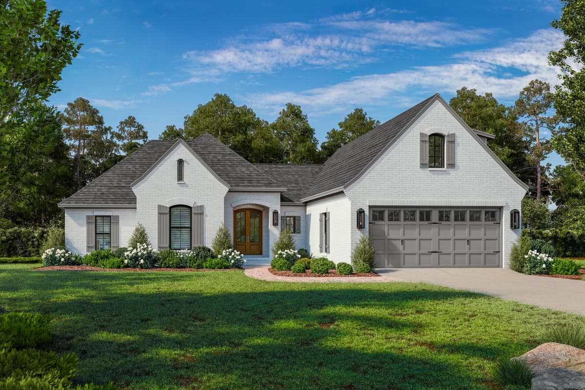 House plan exterior: One-story white brick home with a prominent gable, arched dormer window, and a three-car garage.