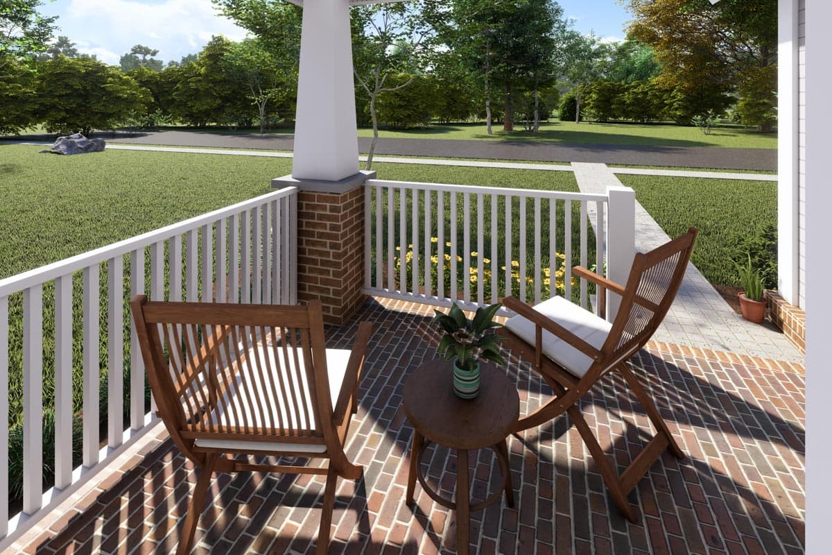 House plan exterior rendering of a porch with brick pillars, white railing, and two wooden chairs.