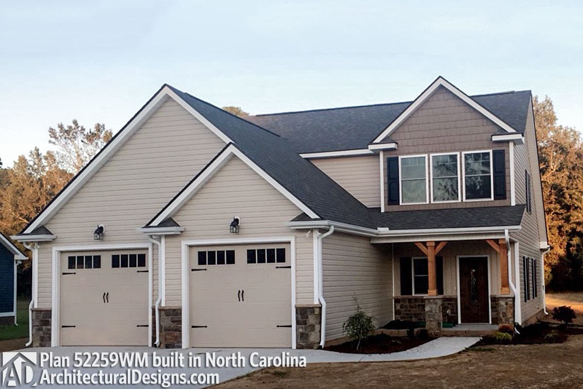 House plan exterior with a two-story Modern Farmhouse style, three-car garage, and covered front porch with timber supports.