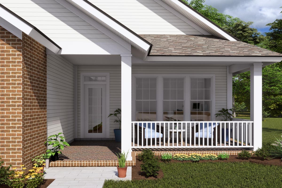 House plan exterior: One-story home with brick accent, front porch with white railing, and gable roof.