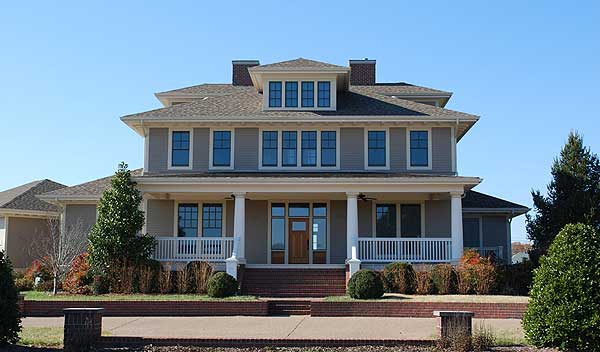 Craftsman style house plan exterior with wrap-around porch, multiple gables, and dormer windows.